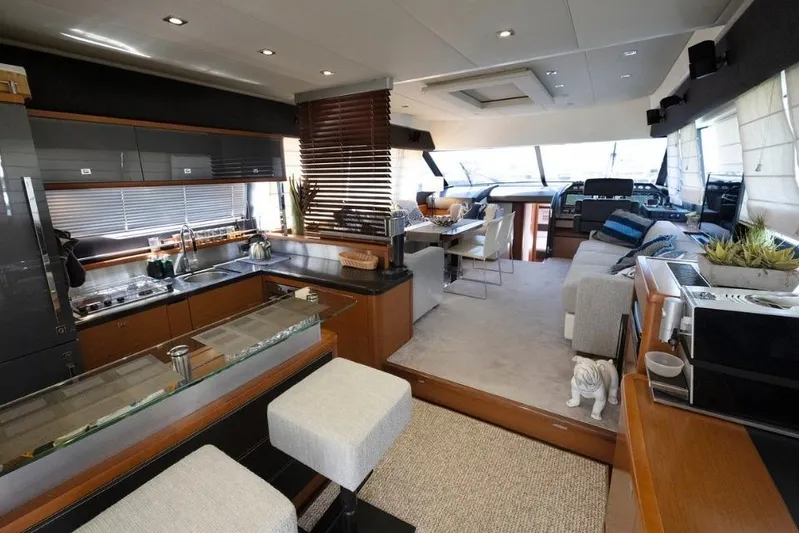  Yacht Photos Pics Luxurious interior of a 2013 Prestige 620 yacht with modern kitchen and seating area.