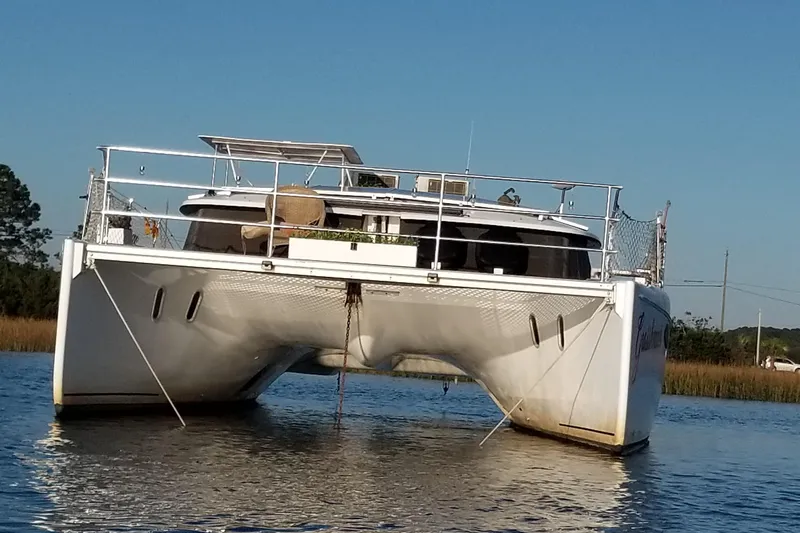 Grasshopper Yacht Photos Pics 2011 Fountaine Pajot Orana 44 Grand Large catamaran on calm water.