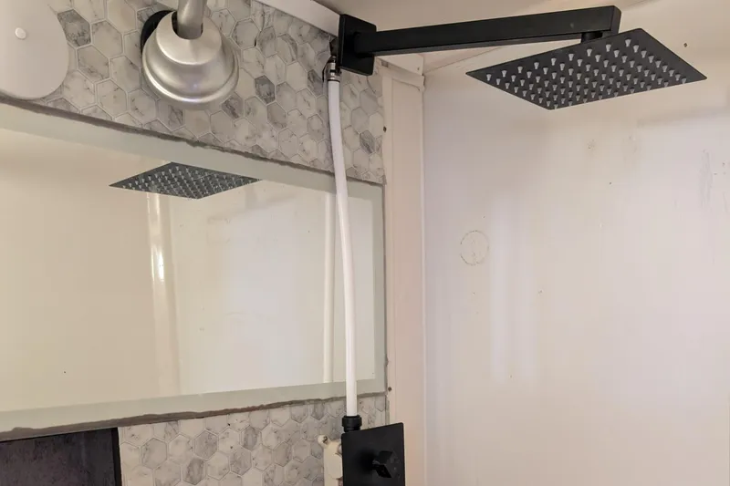 Grasshopper Yacht Photos Pics Modern shower with hexagonal tiles in 2011 Fountaine Pajot Orana 44 Grand Large.