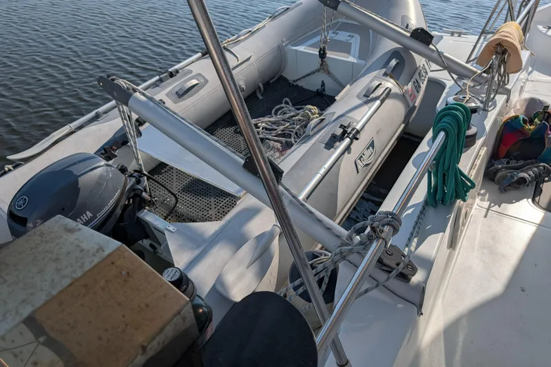 Grasshopper Yacht Photos Pics 2011 Fountaine Pajot Orana 44 Grand Large with dinghy and Yamaha motor on deck.