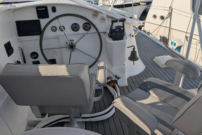 Grasshopper Yacht Photos Pics Helm station of 2011 Fountaine Pajot Orana 44 Grand Large catamaran with steering wheel and controls.