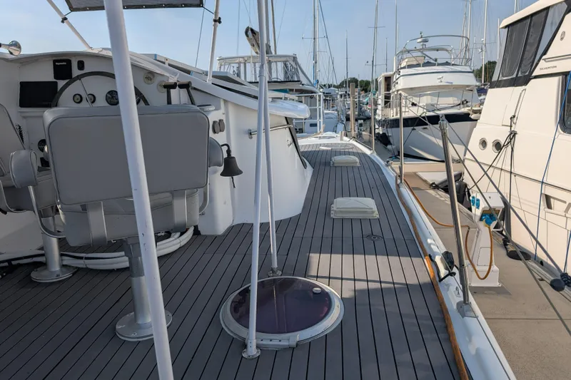 Grasshopper Yacht Photos Pics Deck view of 2011 Fountaine Pajot Orana 44 Grand Large catamaran in marina.