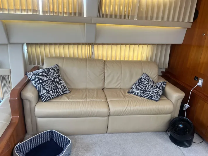  Yacht Photos Pics Beige leather sofa with patterned pillows in 2006 Carver 430 Cockpit Motor Yacht interior.