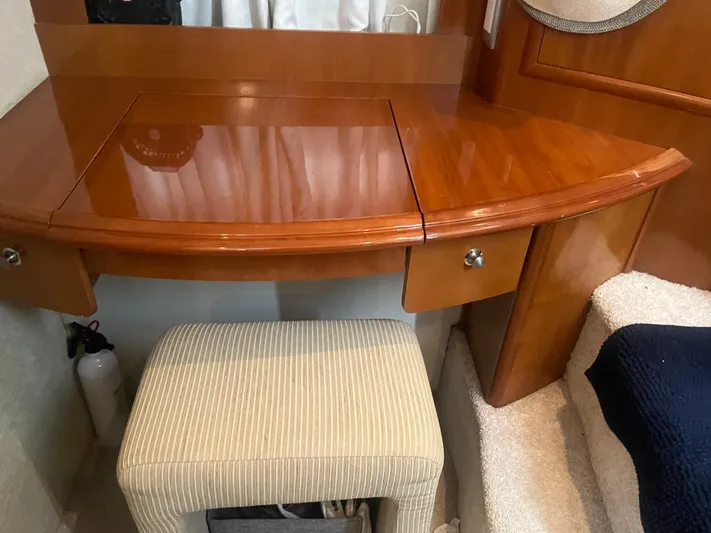  Yacht Photos Pics Wooden vanity desk with stool in 2006 Carver 430 Cockpit Motor Yacht interior.