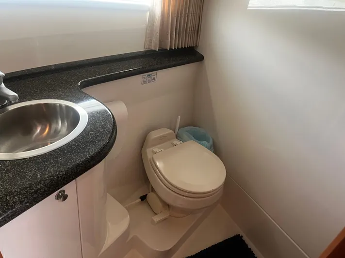  Yacht Photos Pics 2006 Carver 430 Cockpit Motor Yacht bathroom with sink and toilet.