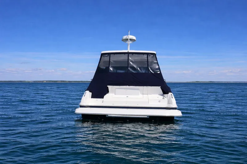  Yacht Photos Pics 2019 Regal 42 Grande Coupe yacht on open water, rear view.