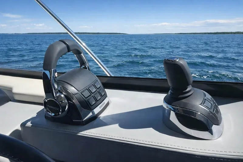  Yacht Photos Pics 2019 Regal 42 Grande Coupe controls with ocean view in background.