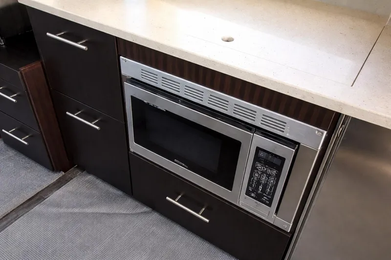  Yacht Photos Pics Modern kitchen area in 2019 Regal 42 Grande Coupe yacht with built-in microwave.