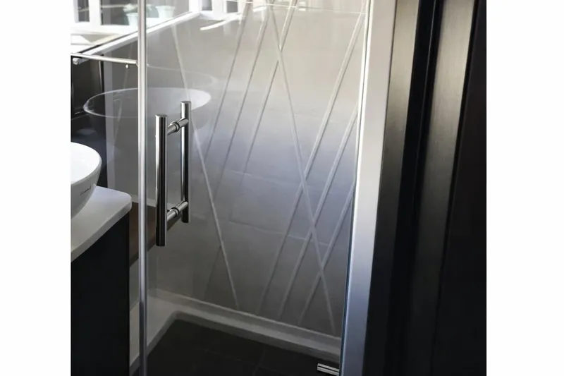  Yacht Photos Pics Shower area in 2019 Regal 42 Grande Coupe with modern glass door and sleek handle.