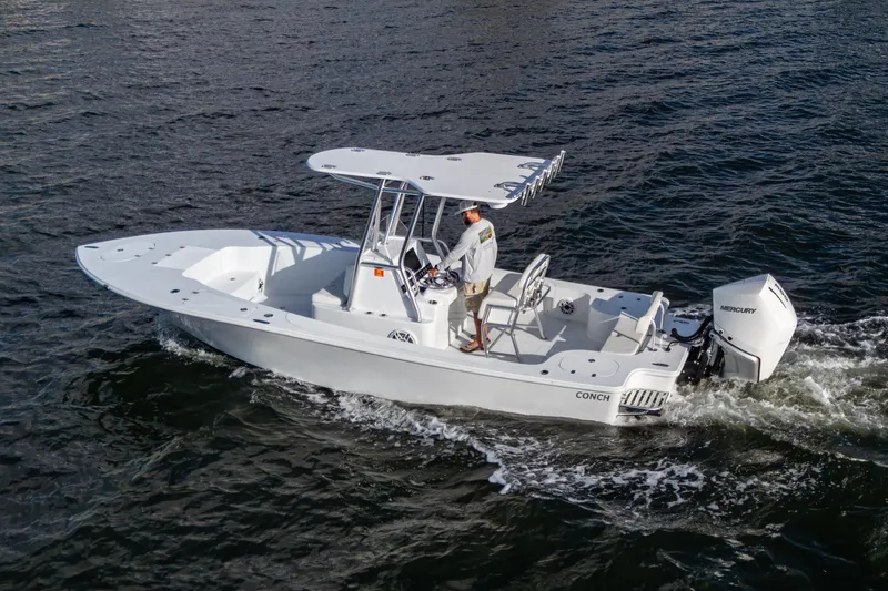  Yacht Photos Pics 2022 Conch 25 boat cruising on water with Mercury outboard engine.
