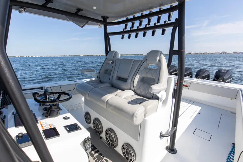 One More Yacht Photos Pics 2022 Contender 44 ST boat interior with luxury seating and ocean view.