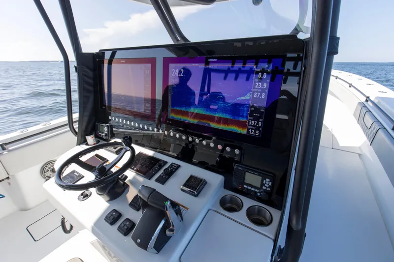 One More Yacht Photos Pics 2022 Contender 44 ST boat dashboard with advanced navigation and control systems.