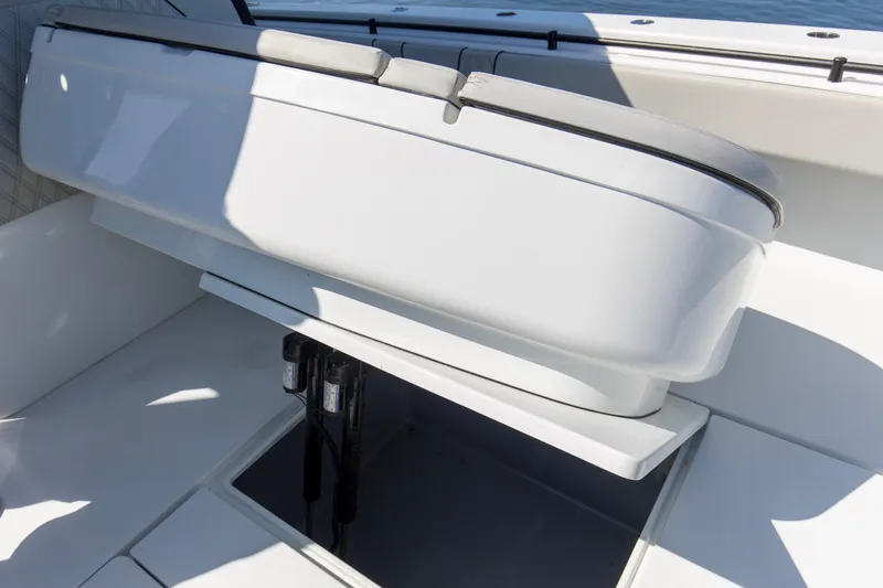 One More Yacht Photos Pics 2022 Contender 44 ST boat interior with storage compartment and seating.