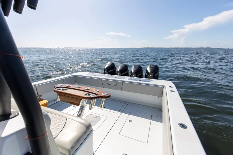 One More Yacht Photos Pics 2022 Contender 44 ST boat on open water, featuring multiple outboard engines.