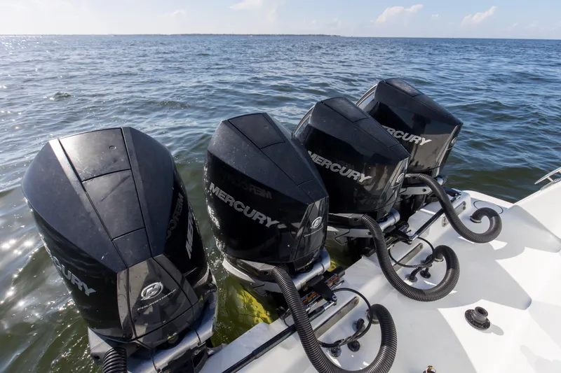 One More Yacht Photos Pics Four Mercury outboard engines on a 2022 Contender 44 ST boat in open water.