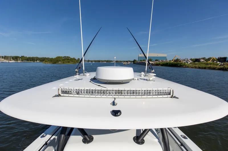 One More Yacht Photos Pics 2022 Contender 44 ST boat on calm water, showcasing sleek design and advanced equipment.