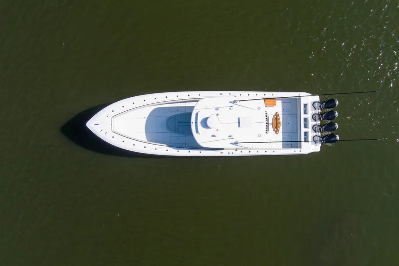 One More Yacht Photos Pics Aerial view of 2022 Contender 44 ST boat on calm water.