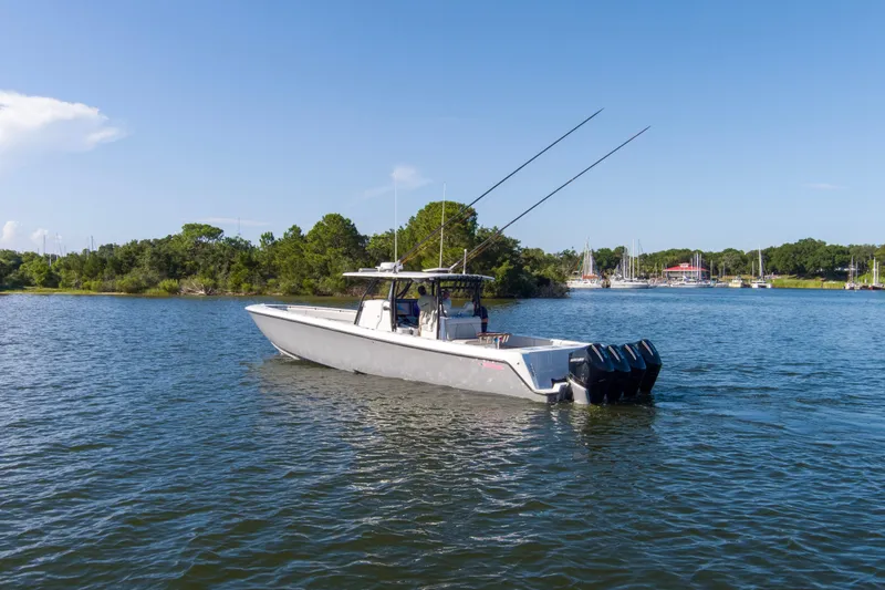 One More Yacht Photos Pics 2022 Contender 44 ST boat on calm water with scenic background.
