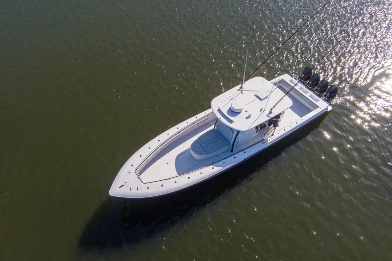 One More Yacht Photos Pics 2022 Contender 44 ST boat on calm water, aerial view.