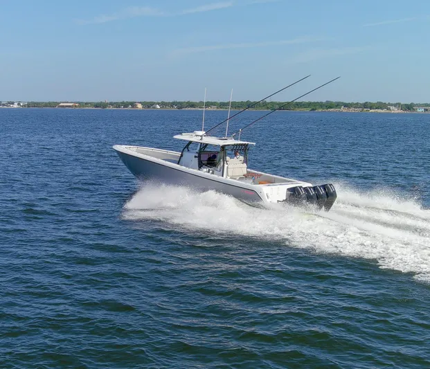 One More Yacht Photos Pics 2022 Contender 44 ST boat cruising on open water, showcasing powerful engines.