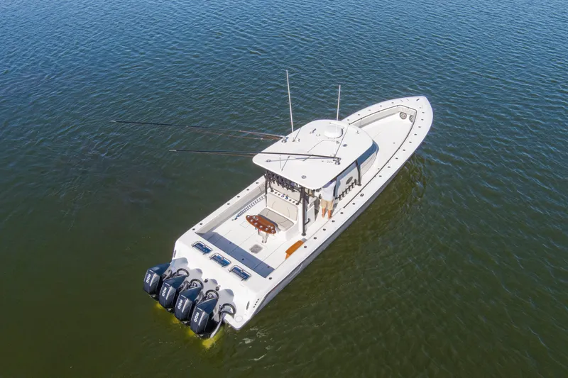 One More Yacht Photos Pics 2022 Contender 44 ST boat with four engines on calm water.