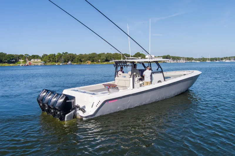 One More Yacht Photos Pics 2022 Contender 44 ST boat on calm water with multiple outboard engines.