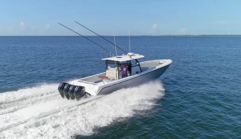 One More Yacht Photos Pics 2022 Contender 44 ST boat cruising on open water, showcasing powerful engines.