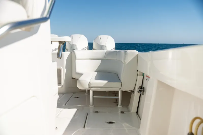  Yacht Photos Pics 2022 SeaVee 390Z boat interior with seating, ocean view in background.