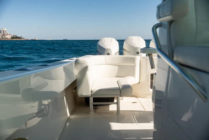  Yacht Photos Pics 2022 SeaVee 390Z boat with white seating and twin Mercury engines on open water.