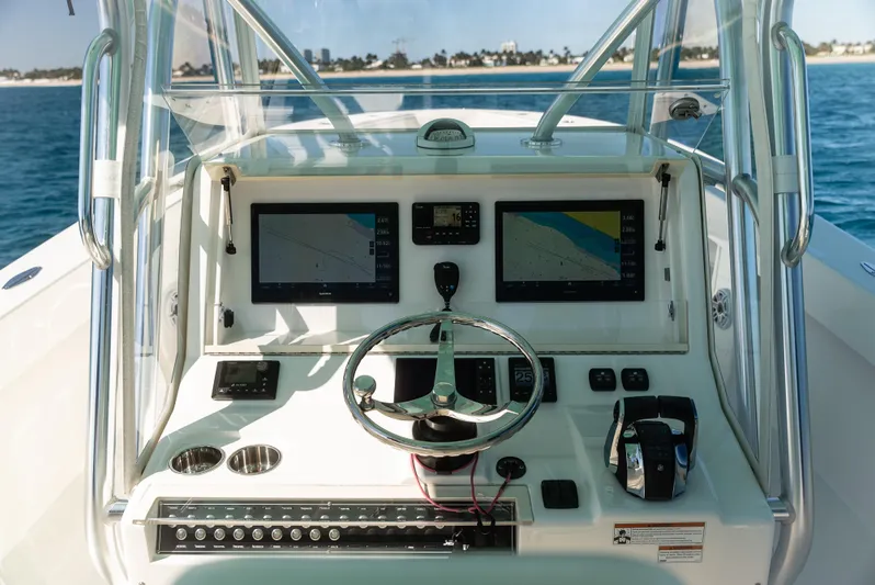 Yacht Photos Pics 2022 SeaVee 390Z boat dashboard with dual navigation screens and steering wheel.