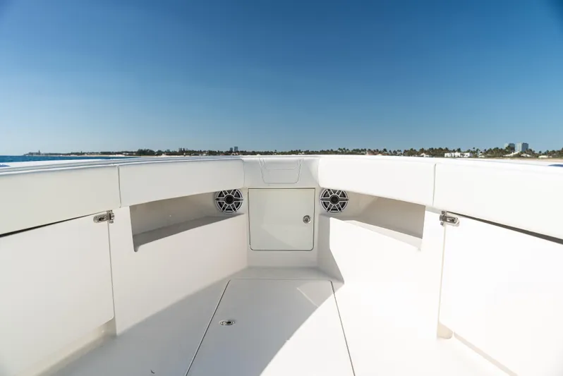  Yacht Photos Pics 2022 SeaVee 390Z boat interior with speakers, under clear blue sky.