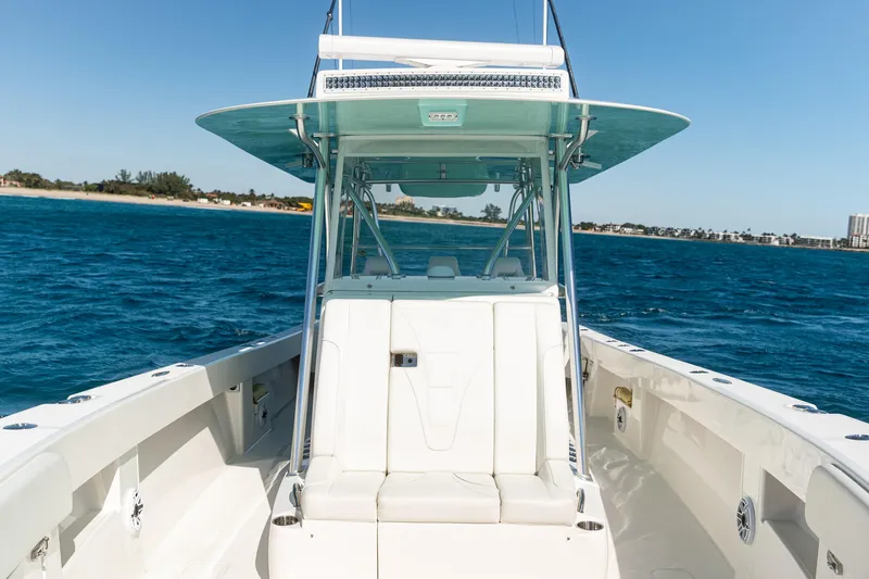  Yacht Photos Pics 2022 SeaVee 390Z boat on blue water, showcasing sleek design and spacious deck.