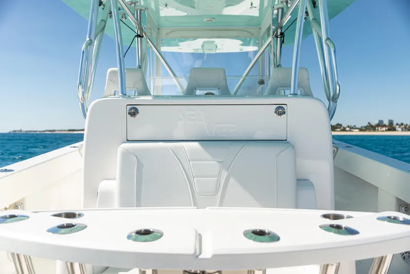  Yacht Photos Pics 2022 SeaVee 390Z boat interior with seating and rod holders, on a sunny day at sea.