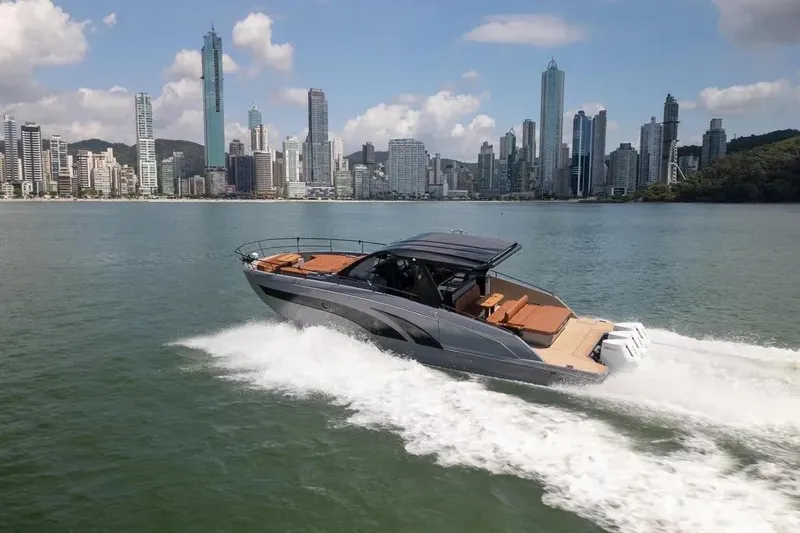  Yacht Photos Pics Luxury Hanover 447 yacht cruising near city skyline, 2025 model.