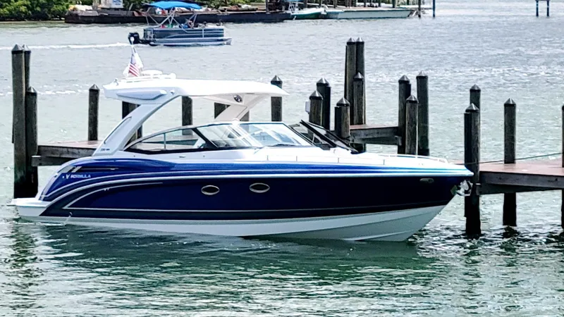  Yacht Photos Pics 2023 Formula 330 Crossover Bowrider docked in a scenic marina setting.