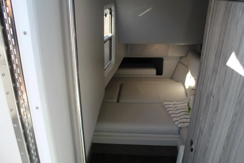  Yacht Photos Pics 2023 Formula 330 Crossover Bowrider cabin interior with cozy seating and modern design.