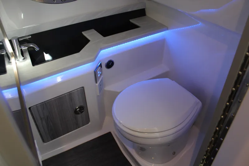  Yacht Photos Pics 2023 Formula 330 Crossover Bowrider bathroom with modern fixtures and ambient lighting.