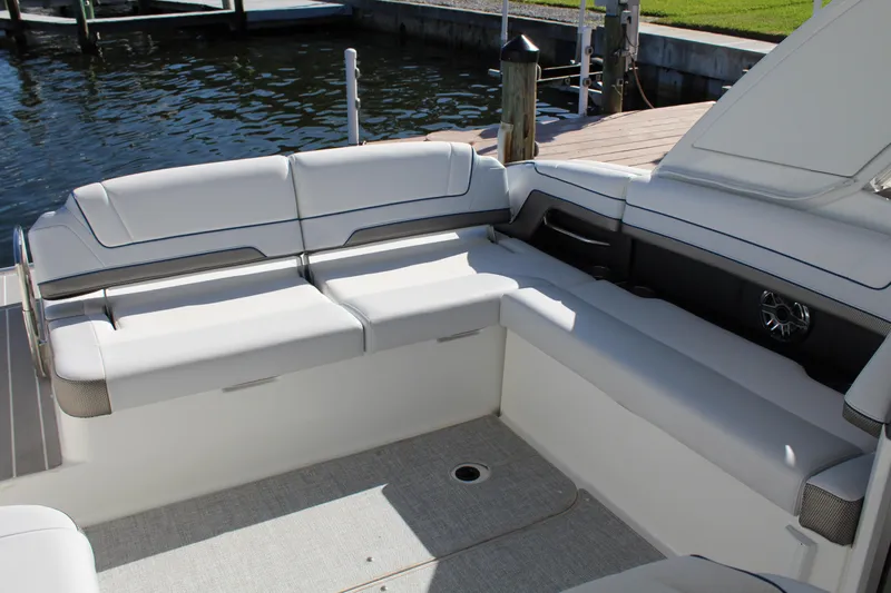  Yacht Photos Pics 2023 Formula 330 Crossover Bowrider interior seating area by the water.