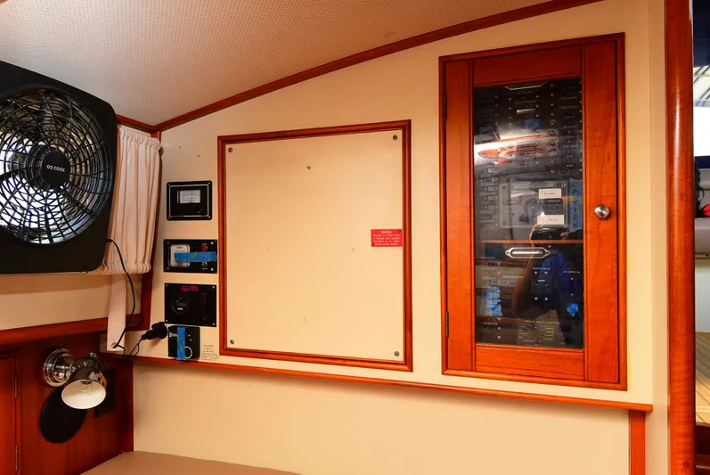  Yacht Photos Pics 1994 Grand Banks 38 Eastbay interior with control panel and fan.