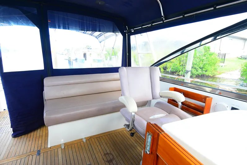  Yacht Photos Pics Interior of 1994 Grand Banks 38 Eastbay yacht with seating and helm station.