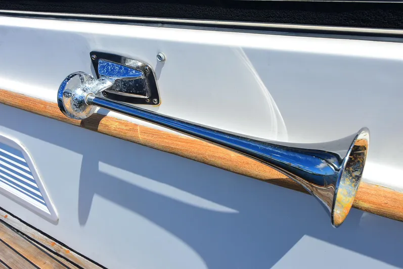 Yacht Photos Pics Chrome horn on 1994 Grand Banks 38 Eastbay yacht, mounted on white and wood panel.