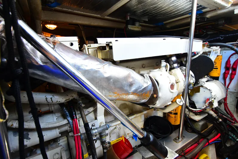  Yacht Photos Pics Engine room of 1994 Grand Banks 38 Eastbay, showcasing mechanical components and wiring.