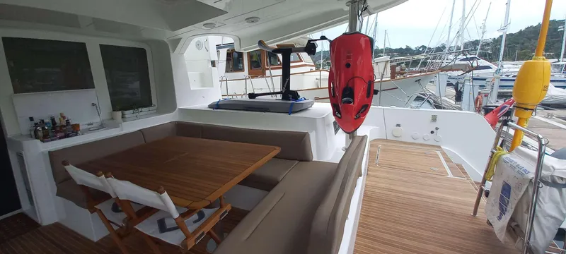 Amea Yacht Photos Pics Spacious deck of 2014 Lagoon 52 F yacht with seating and dining area.
