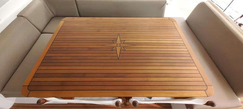 Amea Yacht Photos Pics Luxurious Lagoon 52 F 2014 yacht interior with elegant wooden table and comfortable seating.