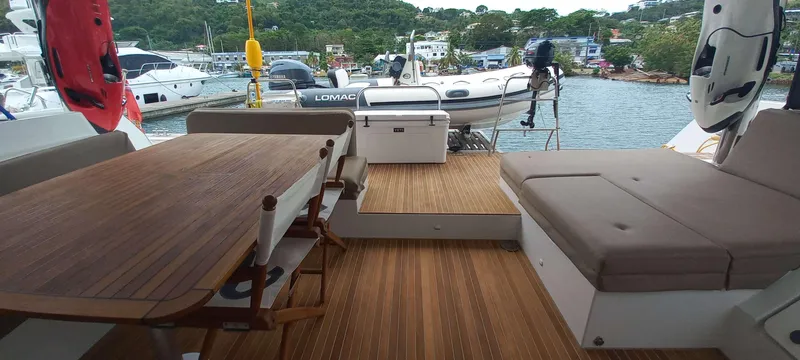 Amea Yacht Photos Pics Spacious deck of 2014 Lagoon 52 F yacht with seating and dining area.