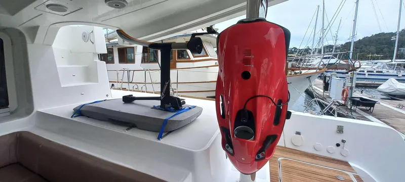 Amea Yacht Photos Pics 2014 Lagoon 52 F yacht interior with mounted red underwater scooter and paddleboard.