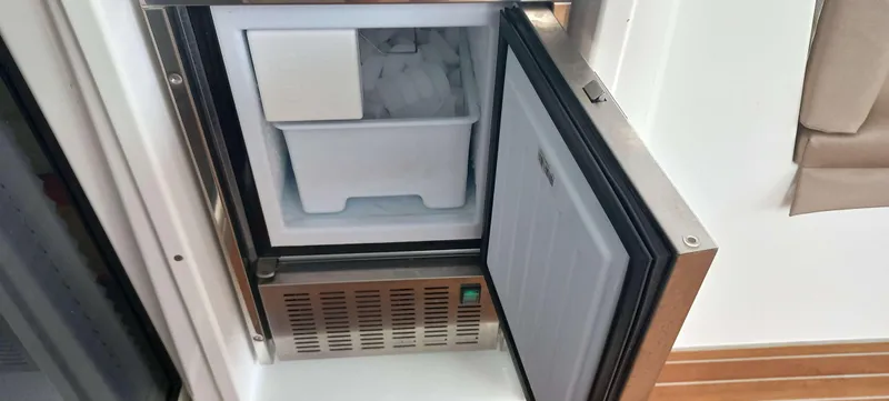 Amea Yacht Photos Pics Open freezer on Lagoon 52 F yacht, showing ice compartment, 2014 model.