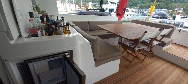 Amea Yacht Photos Pics Luxurious Lagoon 52 F yacht interior with seating, table, and bar area, 2014 model.