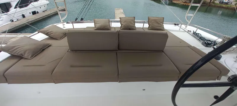 Amea Yacht Photos Pics Luxurious 2014 Lagoon 52 F yacht with spacious deck seating and cushions.