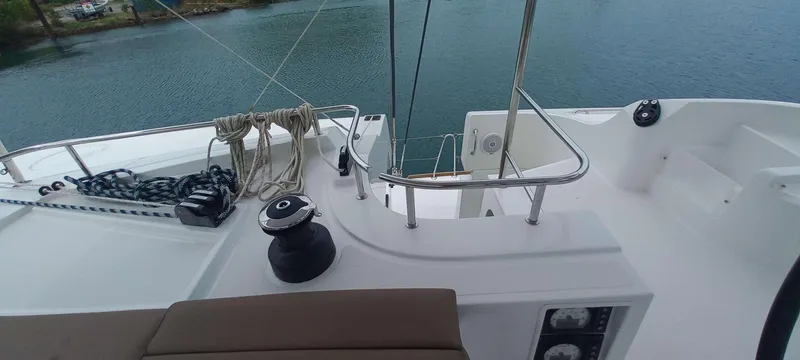 Amea Yacht Photos Pics Lagoon 52 F yacht deck, 2014 model, featuring winch and ropes by the water.